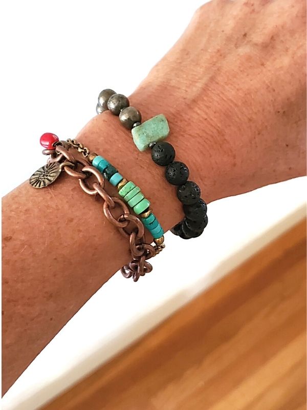 colorful gemstone stack on arm